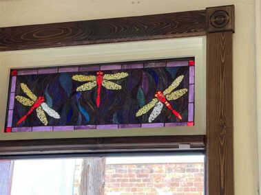 The dragonfly is our Twin Flame Gallery mascot. It was a common Victorian symbol that means “transformation." You’ll see it in a lot of Victorian artwork and decorations. We found this stained glass panel and our contractor, Travis Phillips, expertly installed it in our back door transom. It turned out even better than we expected, strangely, the dragonfly eyes are especially illuminated in the light, more so than any other part of the panel.